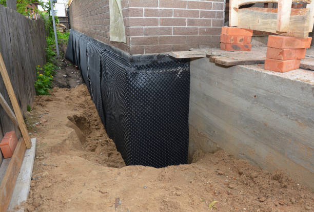 Happy homeowners after waterproofing job in Mears